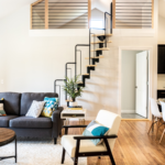 gray sofa beside white wall