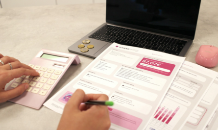 Someone is calculating their finances with documents.