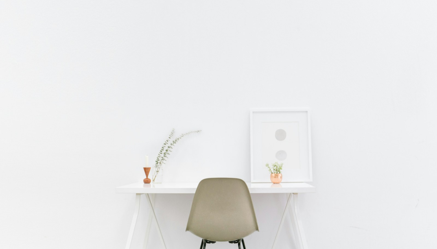 white wooden table near brown chair