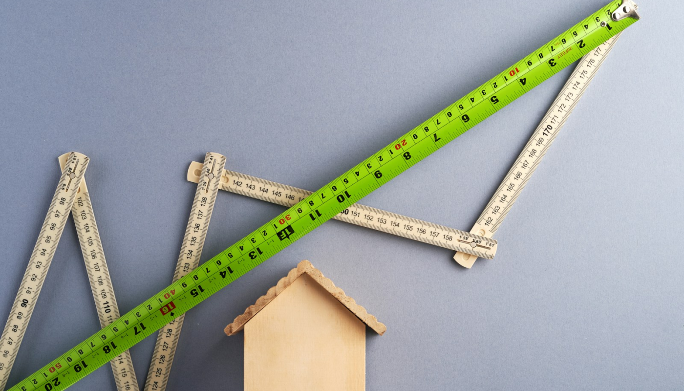 green ruler on white surface