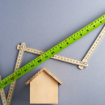 green ruler on white surface