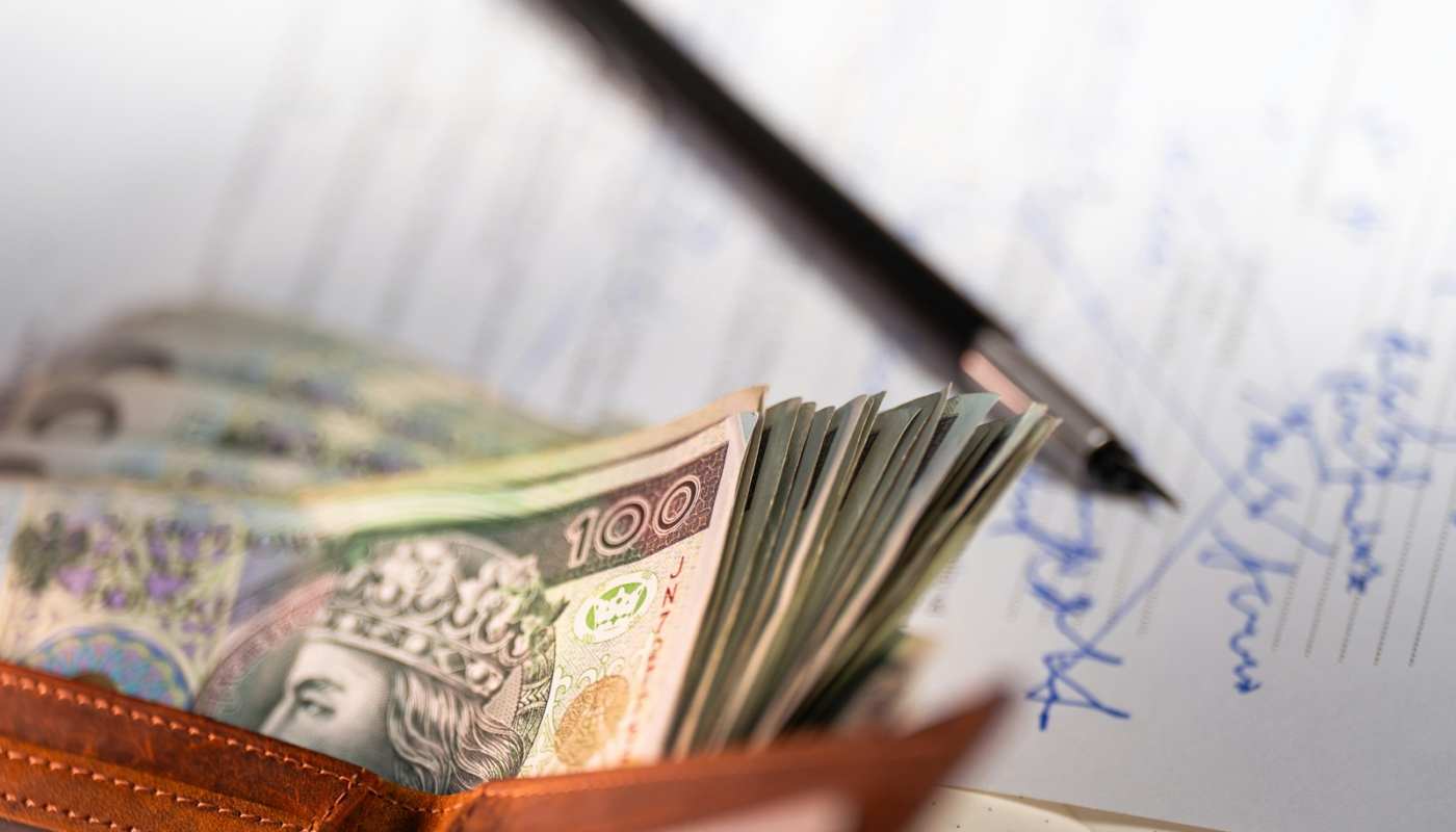 Stack of polish zloty banknotes in a wallet.