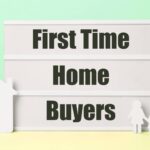 Homebuyer mortgage documents and house keys for closing preparation