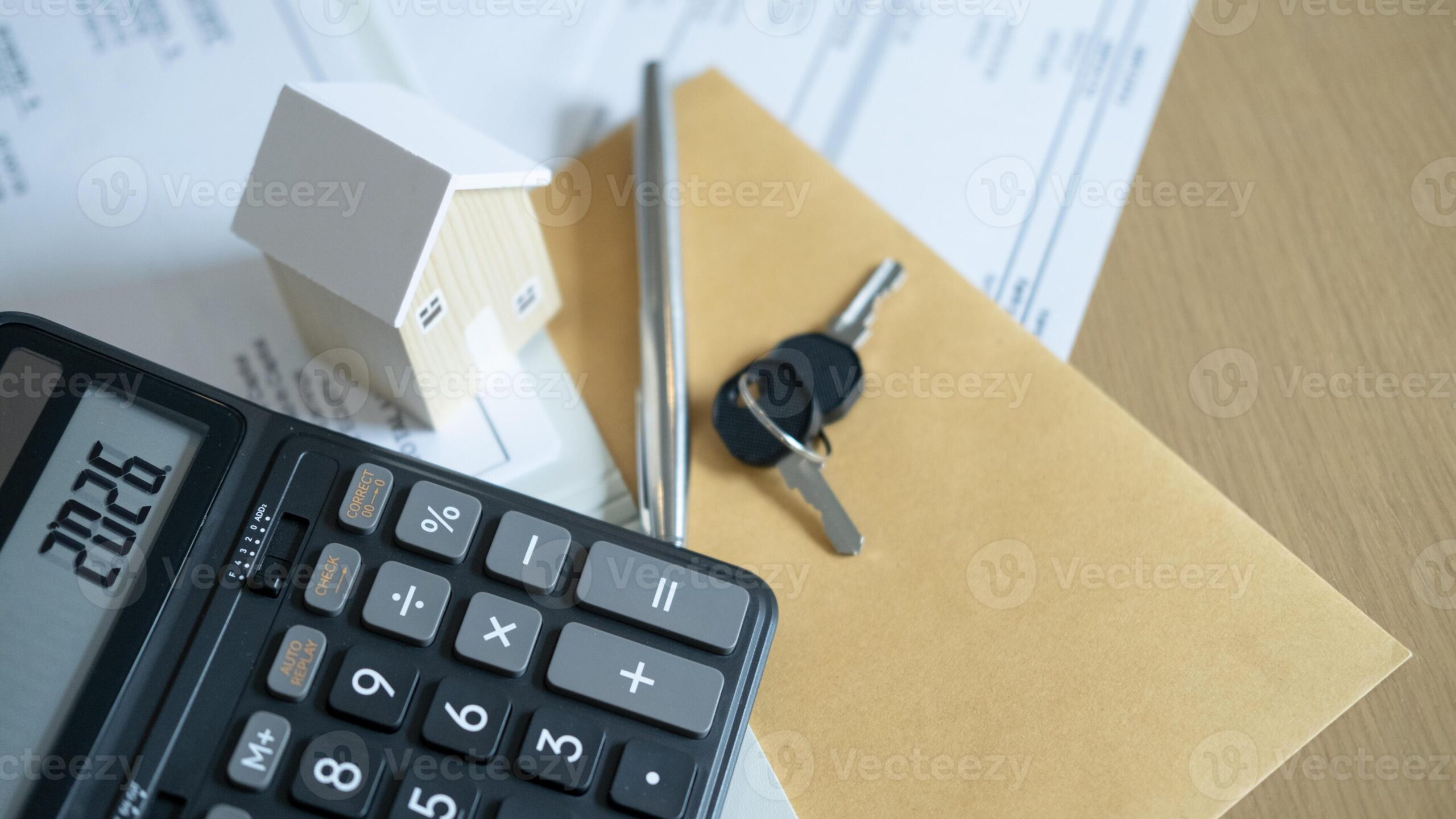 Mortgage application documents and house keys for a first-time buyer