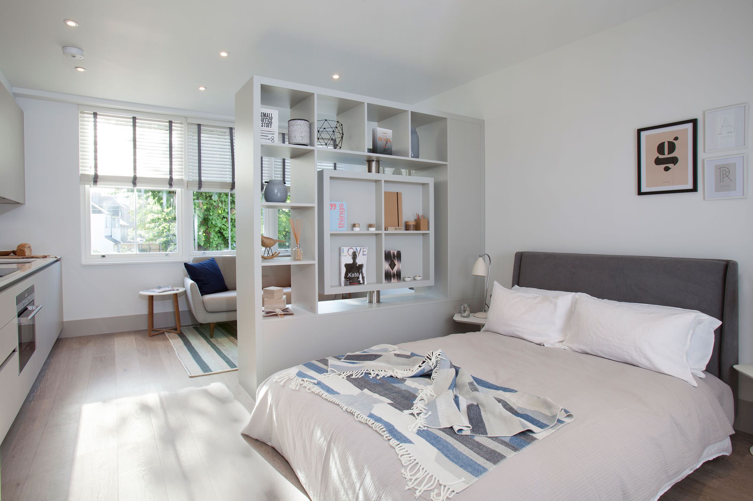 Organized small bedroom with clear storage and walking space