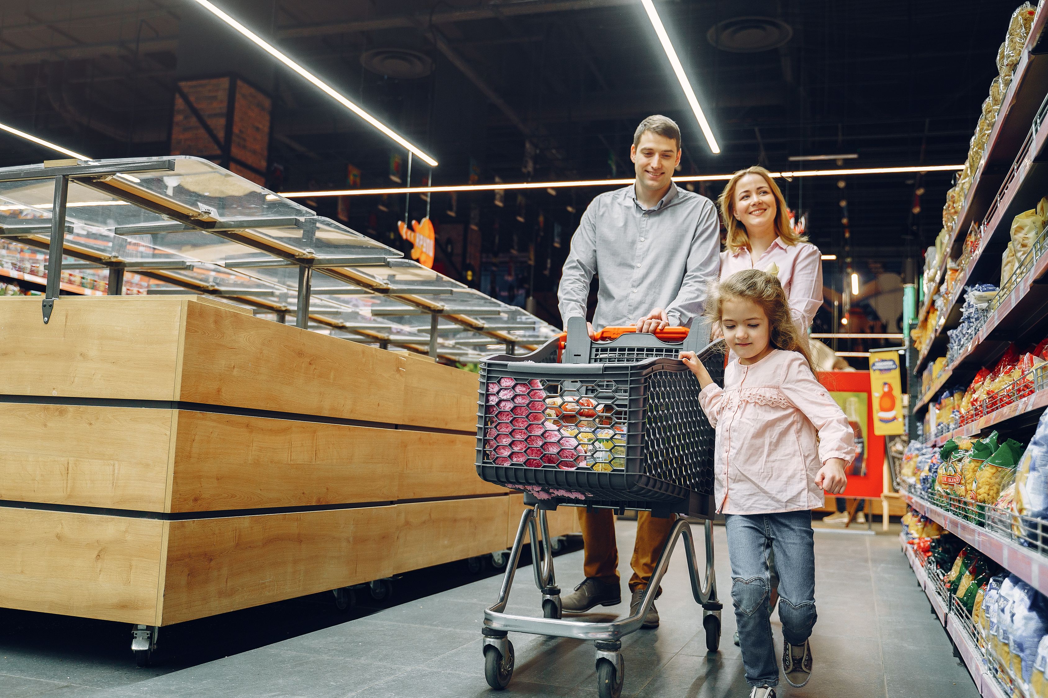 Family buying groceries without overstocking food