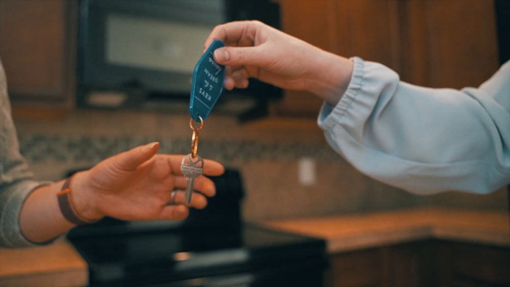 House keys and calculator used for mortgage budget comparison