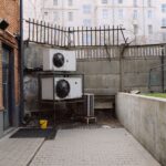 Outdoor heat pump unit beside a home for heating and cooling comparison