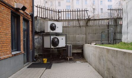 Outdoor heat pump unit beside a home for heating and cooling comparison