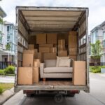 Moving boxes prepared for a move to a lower-cost area